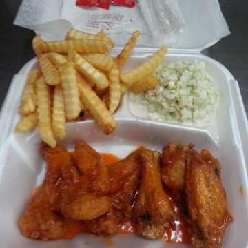 3 Wings and 3 Tenders Lunch Special with fries and slaw (shown with hot sauce)